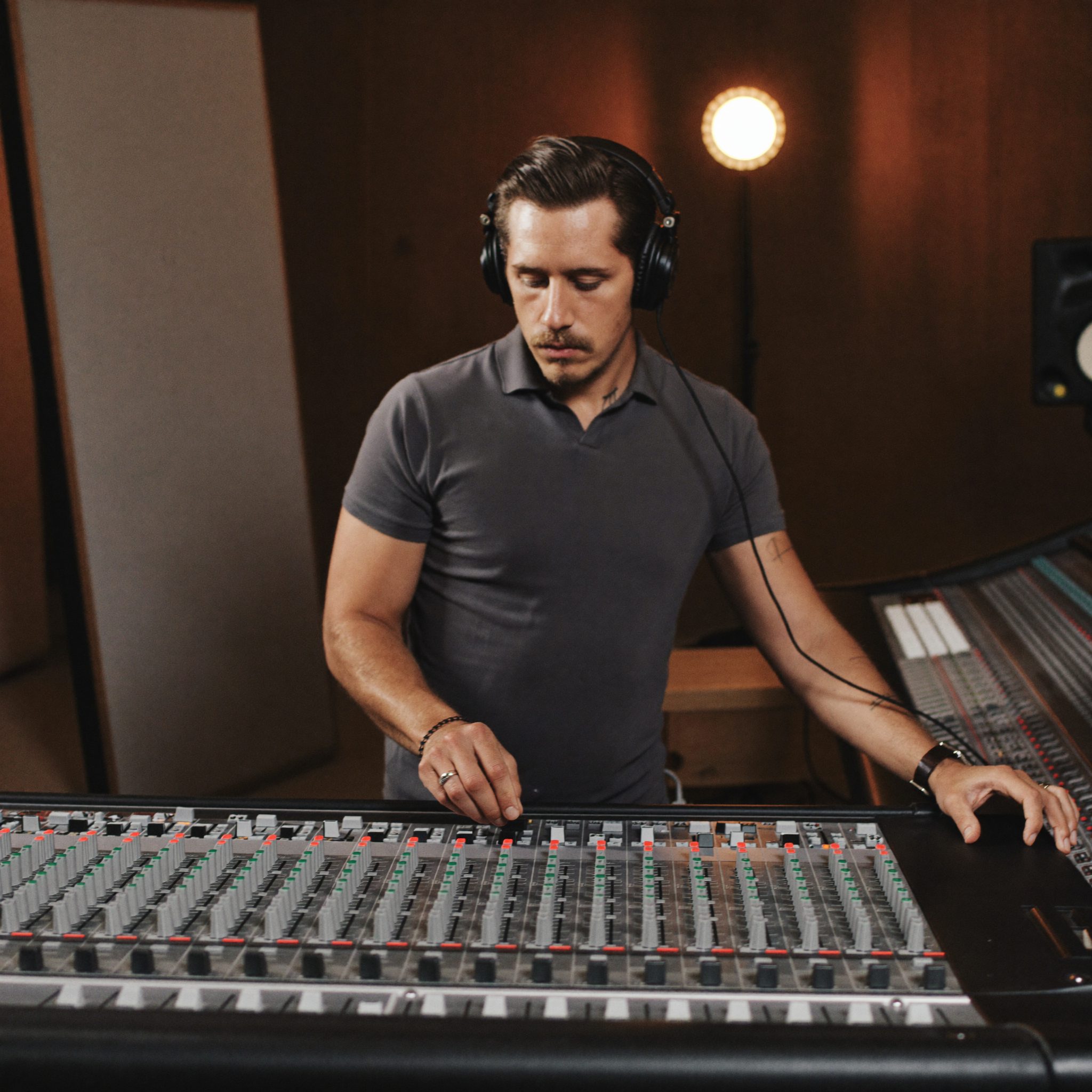 Audio engineer mixing a broadcast post-production session
